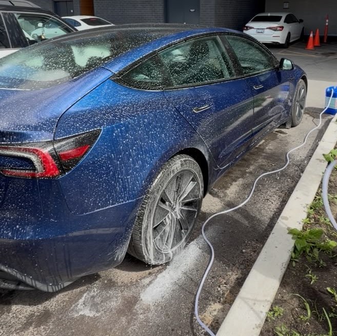 Tesla receiving an exterior wash by Ancore Auto Care
